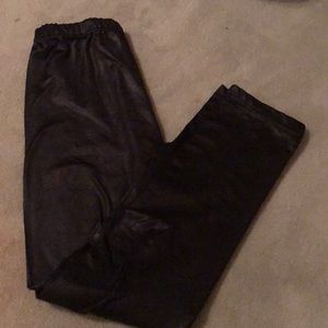 Girls shiny and fuzzy black leggings.